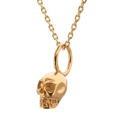 Dije calavera mini dorada incluye cadena